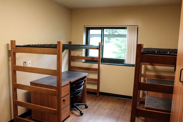 Two beds raised over desks